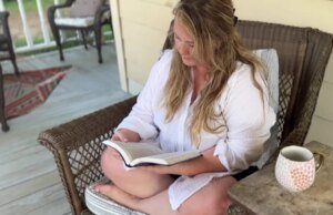 Jenny reading her Bible on the porch while dreaming with God about her future and family life