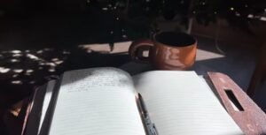 woman journaling with coffee during quiet time reflecting on why I still feel unfulfilled as a Christian